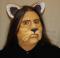 A foam latex cowardly lion nose prosthetic placed on a platic human face cast.